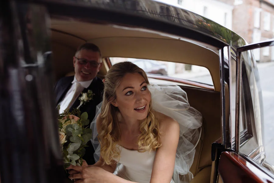 Bride arriving in vintage rolls royce. Leeds best wedding photog bride arriving in vintage rolls royce leeds best wedding photographer