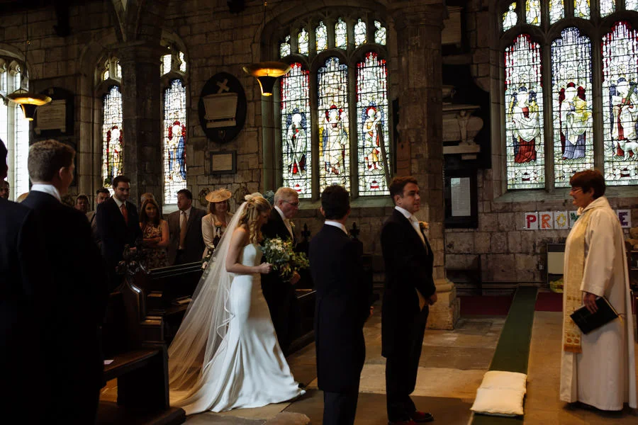 Bride walking down the aisle of St Olave's Church, York. Creativ bride walking down the aisle of st olave s church york creative photographer