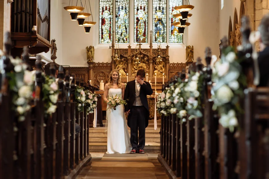 Bride and groom walking down the aisle of St Olave's Church, Yor bride and groom walking down the aisle of st olave s church york