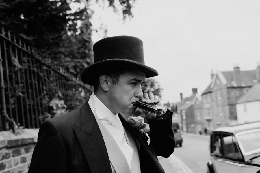 Groom with hip flask. Documentary wedding photographer, York groom with hip flask documentary wedding photographer york
