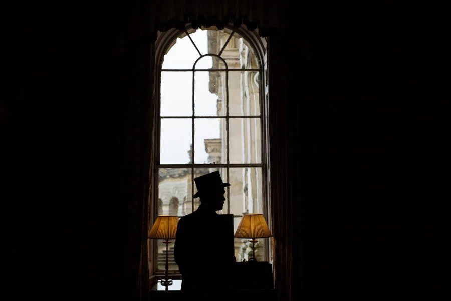 Groom wearing top hat in silhouette at Castle Howard. Creative f groom wearing top hat in silhouette at castle howard creative fine art wedding photographer