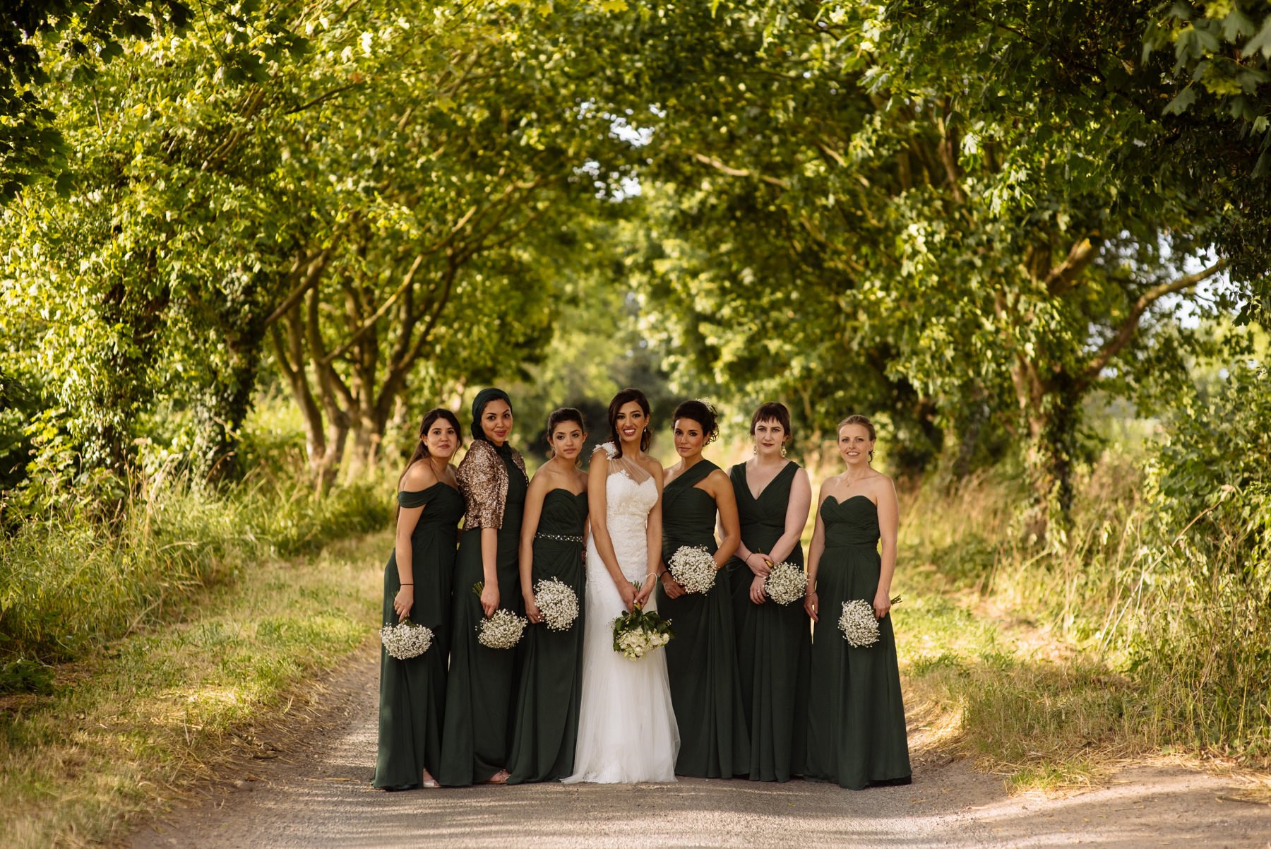 bride with bridesmaids in green gowns normans wedding photographer