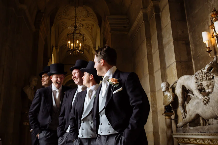 Groomsmen in top hats at Castle Howard. York WEdding photographe groomsmen in top hats at castle howard york wedding photographer