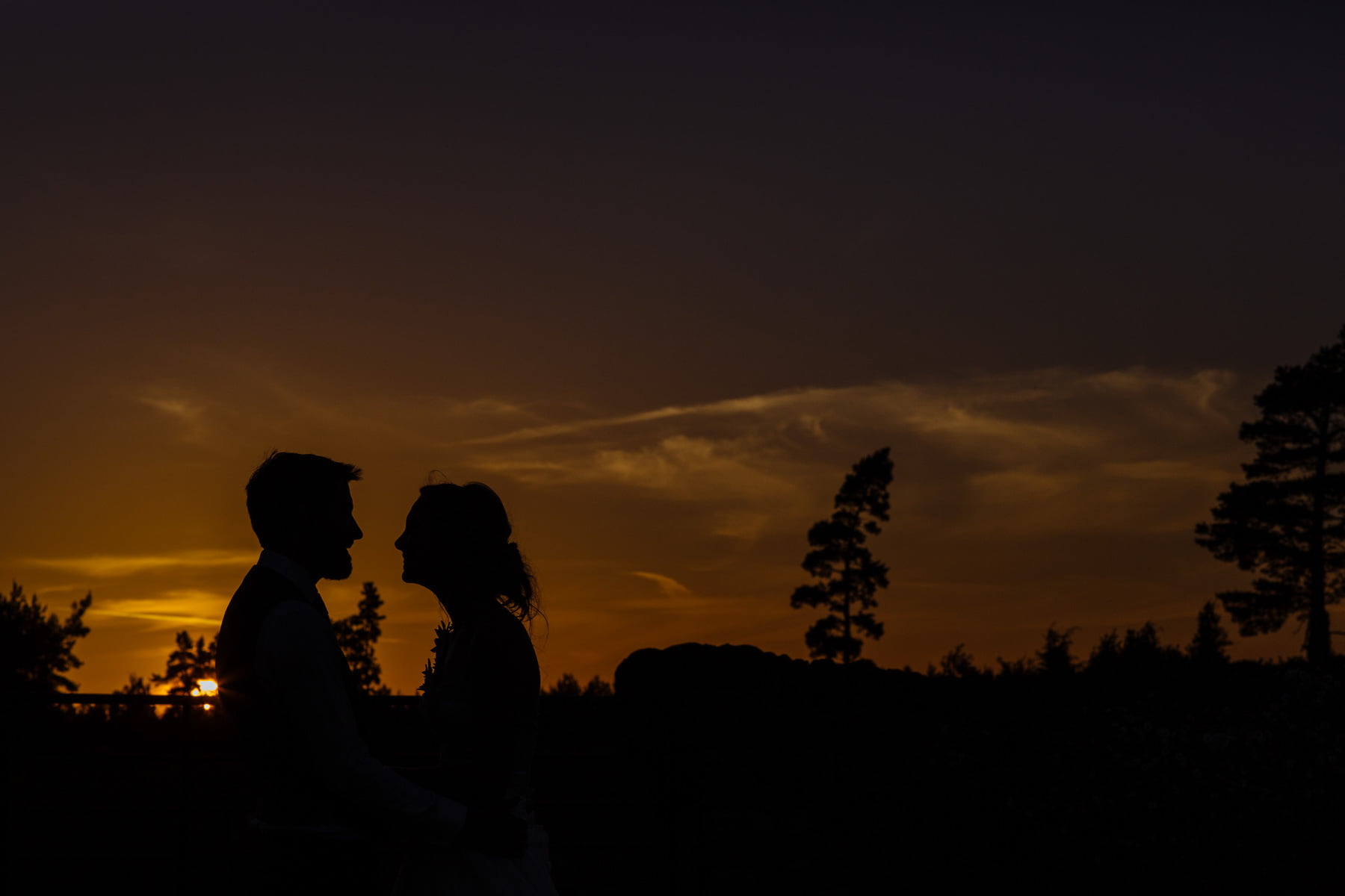 healey barn wedding photographer bride and bridesmaid portrait sunset