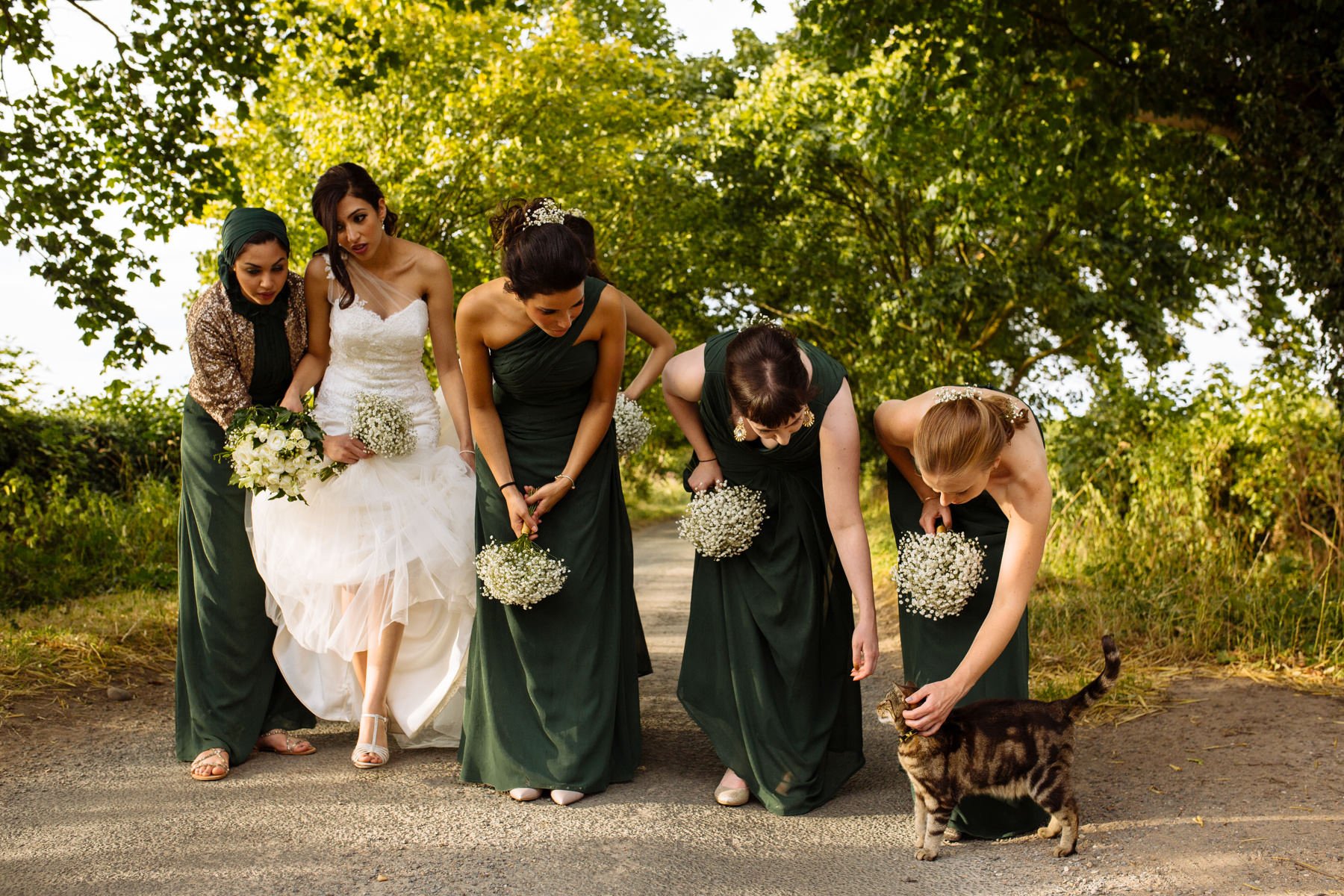 bridesmaids in green gown with cat normans wedding photographer