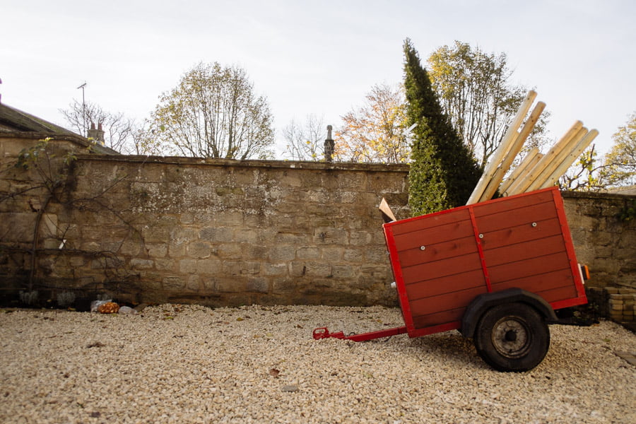 Red trailer with trees