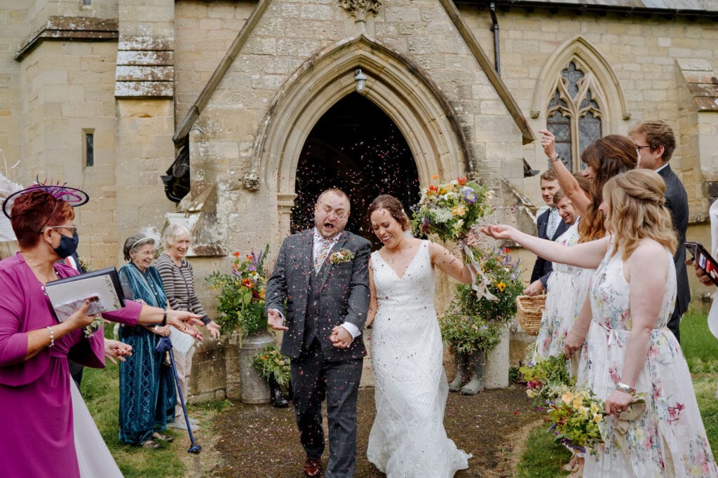bride and groom at church at lodge farm wedding venue cundall