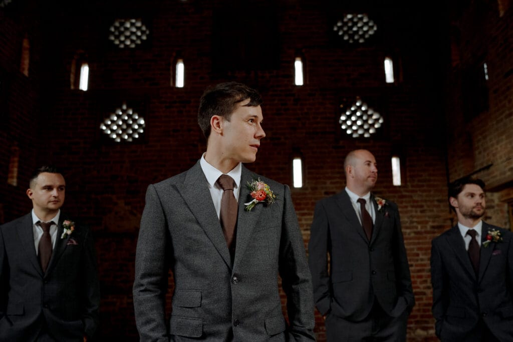 groomsmen wearing grey suits at lodge farm wedding venue cundall