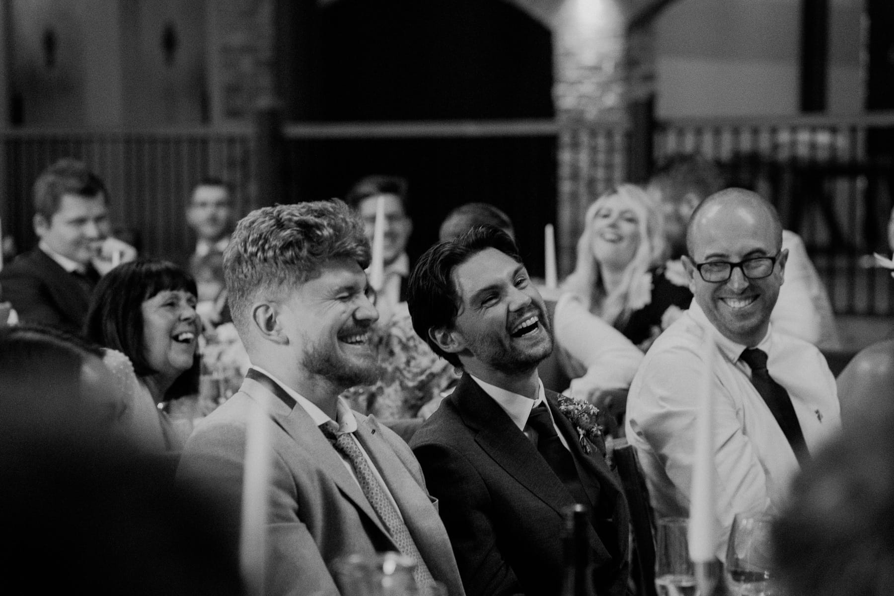 guests laughing during speeches at lodge farm wedding venue cundall