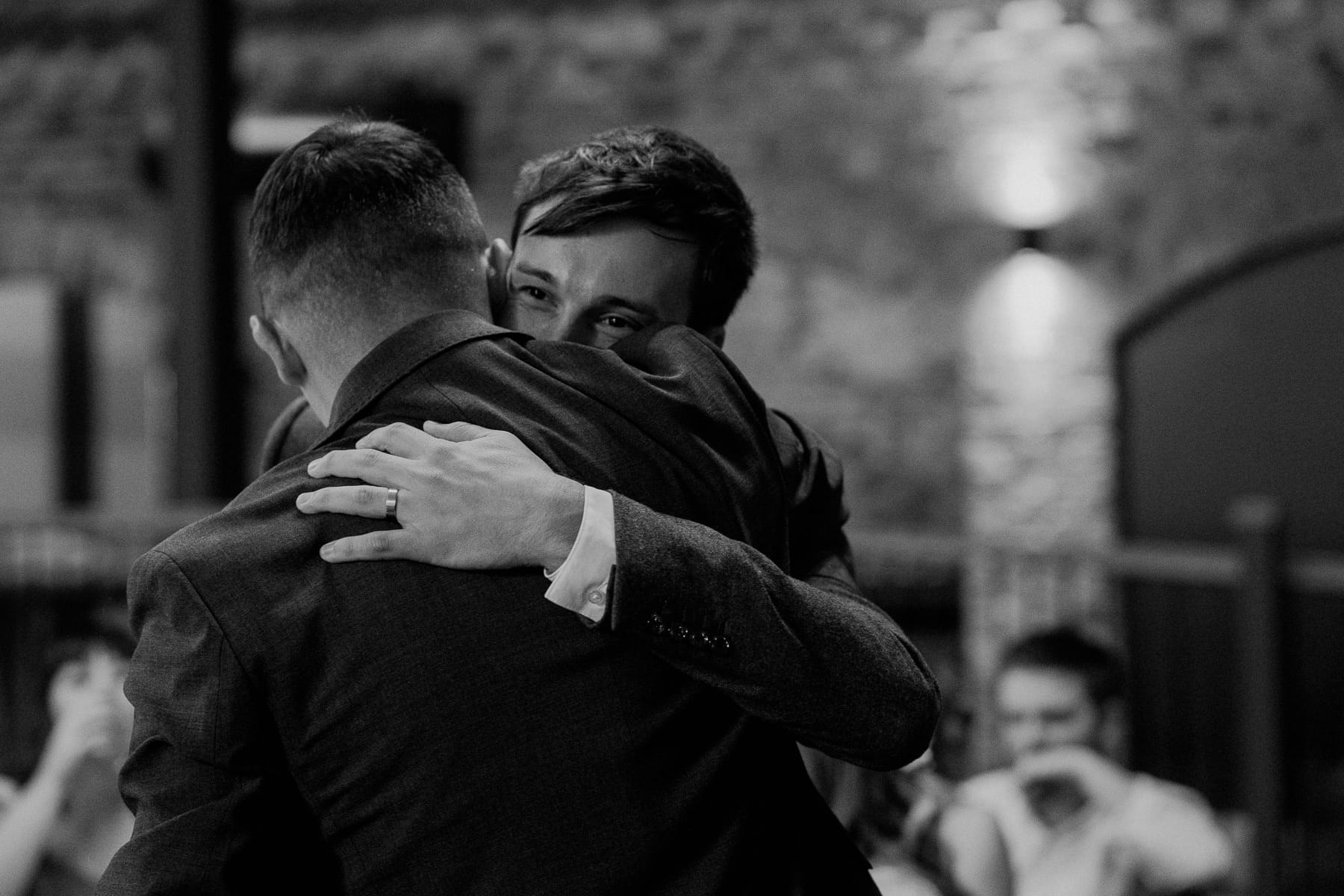 groom hugging best man at lodge farm wedding venue cundall