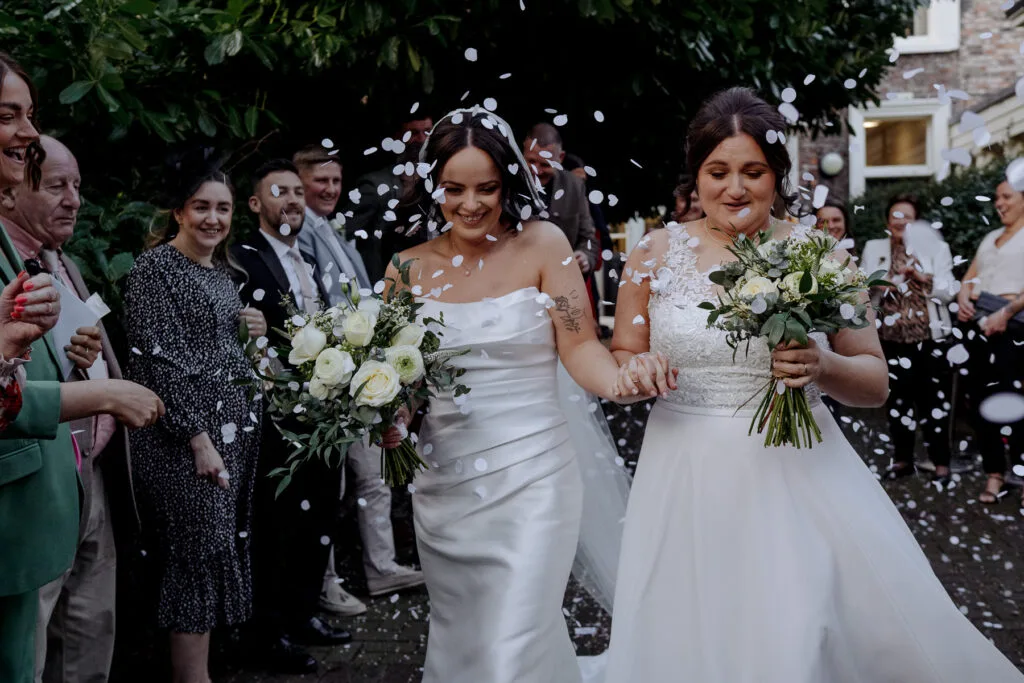 TWO BRIDES with confetti at York register office