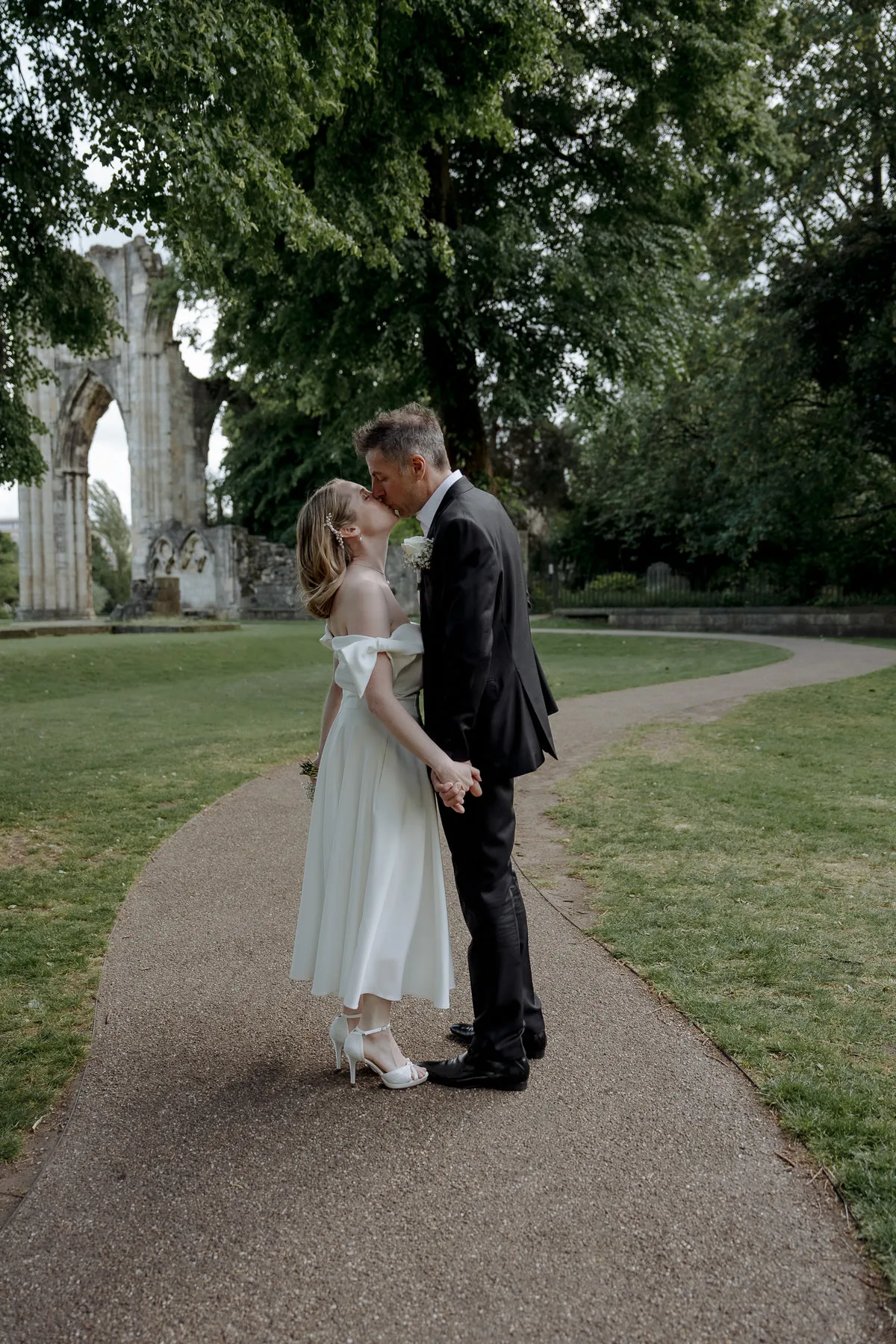 Wedding couple in the Museum Gardens. Wedding reception venues in york city centre